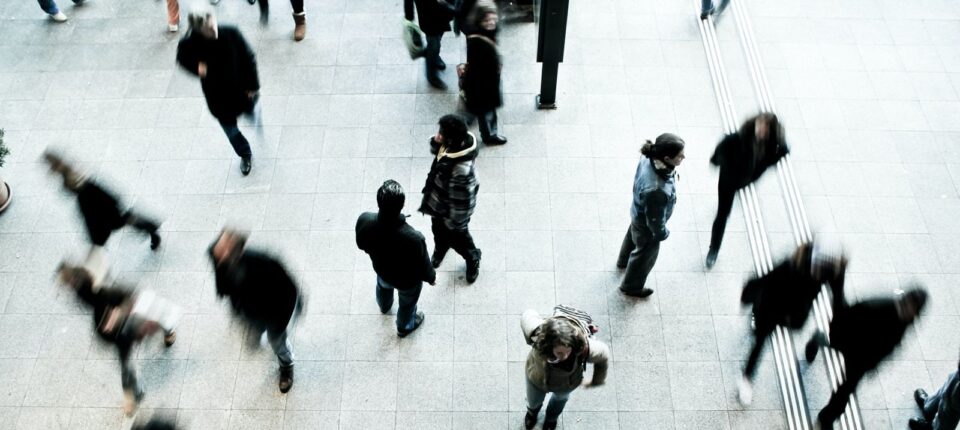 people walking on grey concrete floor during daytime